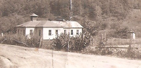 In this photo you can see The Church, well and outhouse